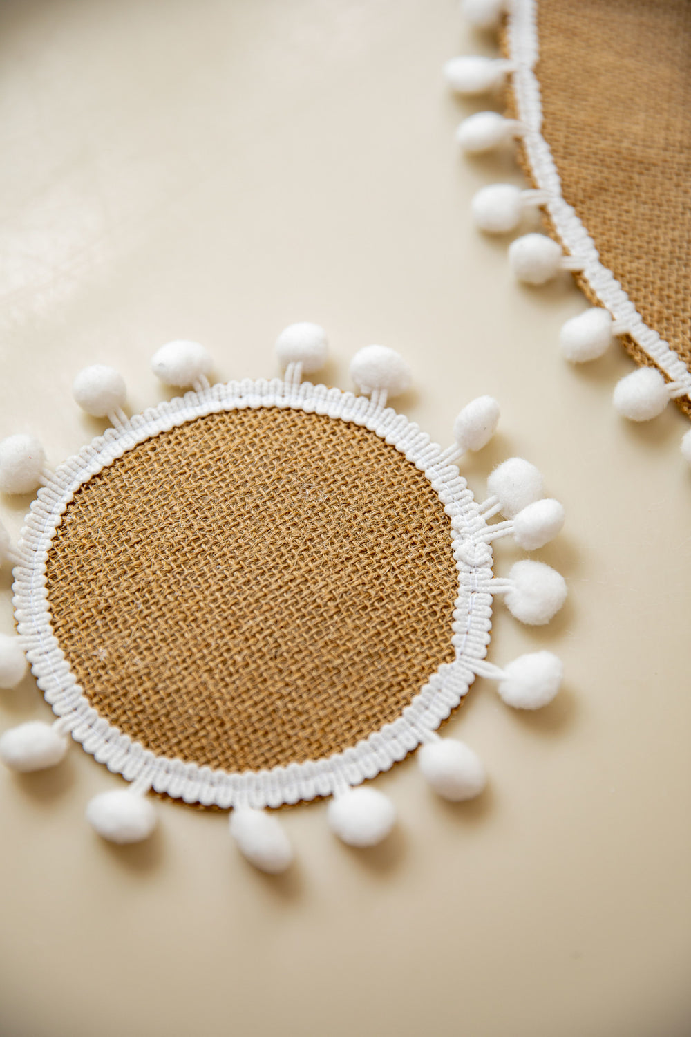 Natural Elements Set of 4 Woven Hessian Drink Coasters with Pom Pom Decorations