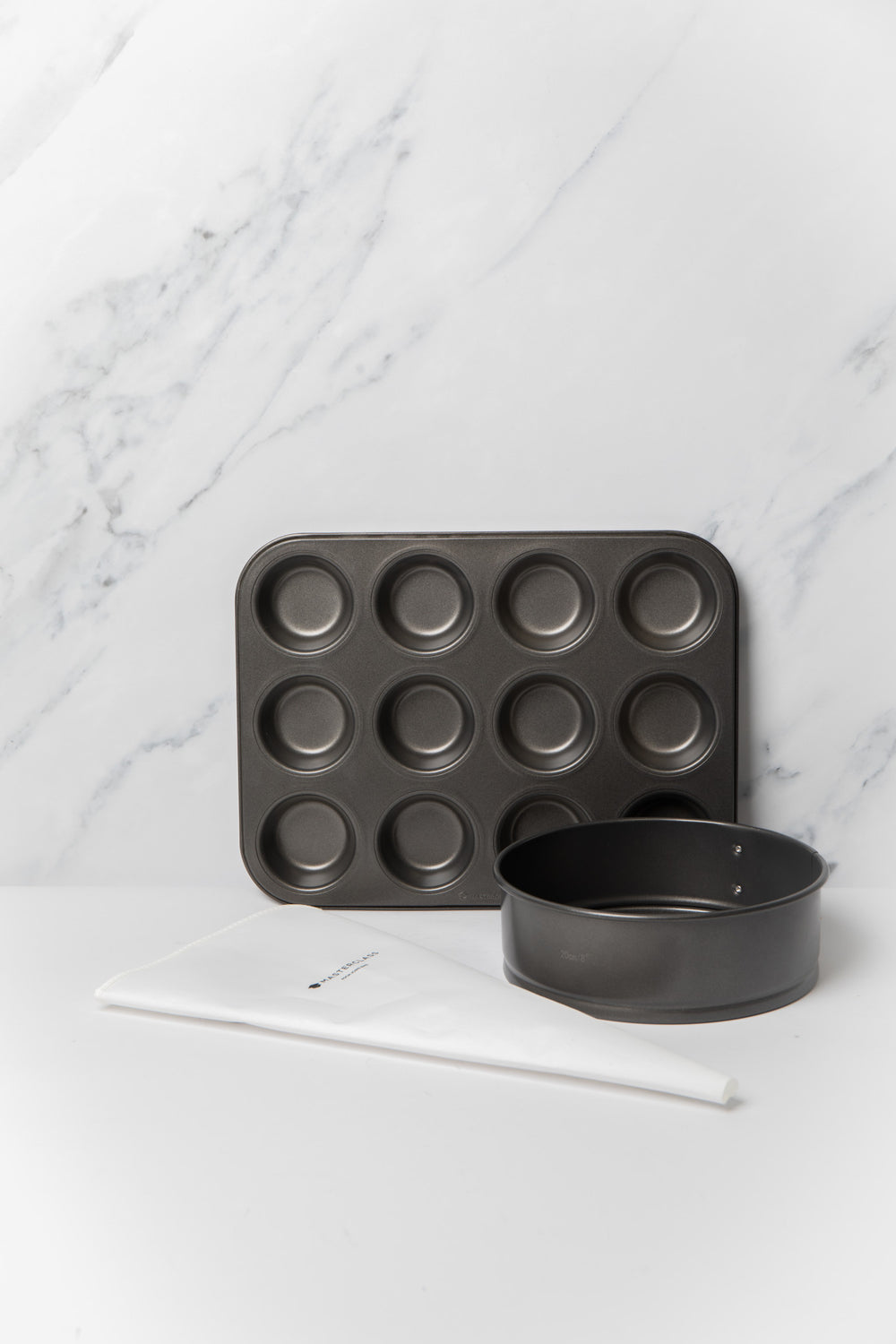 3pc Baking Set with 20cm Non-Stick Spring Form Round Tin, 12-Hole Deep Pan and 40cm Reusable Icing & Piping Bag image 1